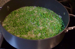 Simmering peas, onion and wine