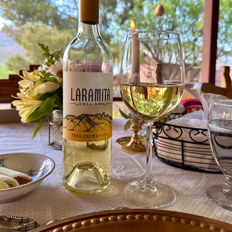 Photo of bottle and glass of Laramita Cellars Tres Primas