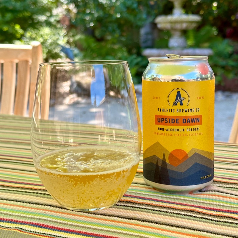 Photo of Athletic Brewing Upside Dawn Golden in can and glass